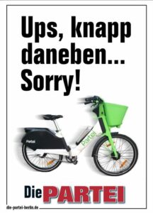 PARTEI-Plakat. Bild von E-Bike mit schwarzer Schrift darüber: "Ups, knapp daneben... Sorry!"
